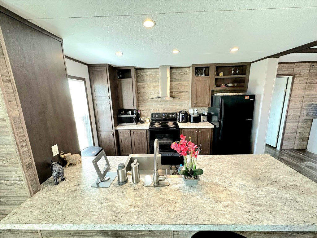 3278 County Road 417 Thorndale, TX 76577 - Photo 5 of 24 a kitchen with refrigerator and sink