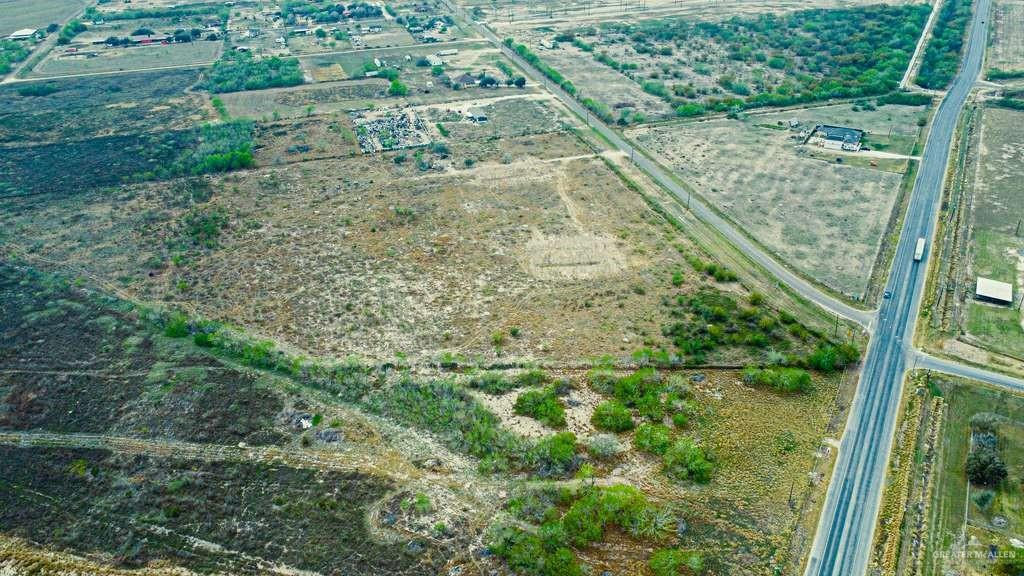 Aerial overview of property's location with rural landscape and large plots for crops