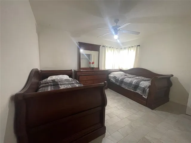 a bedroom with a bed and window