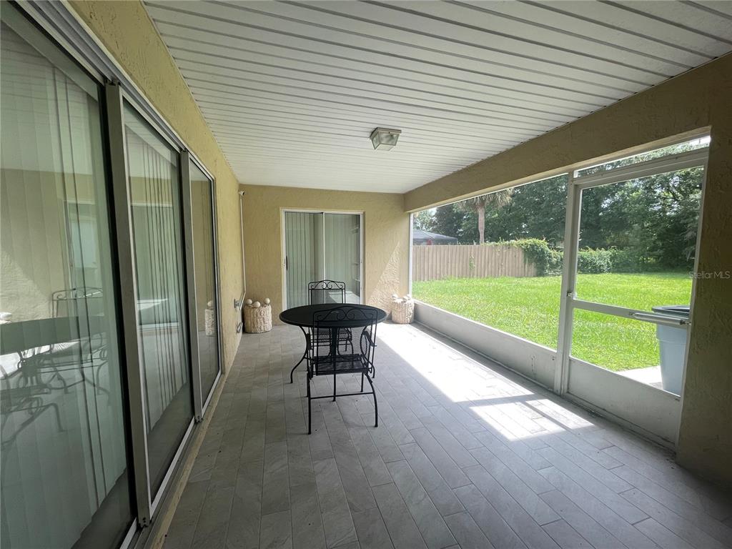 8759 Southwest 52nd Court Ocala, FL 34476 - Photo 17 of 20 a view of an chairs in the balcony