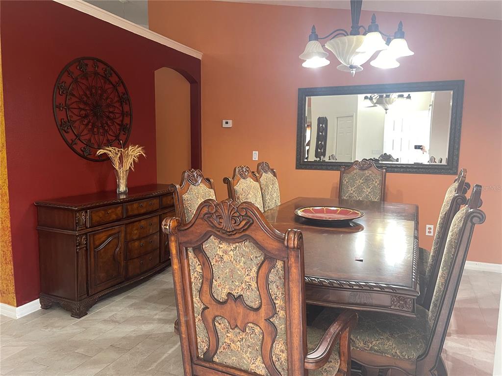 8759 Southwest 52nd Court Ocala, FL 34476 - Photo 4 of 20 a view of a dining room with furniture