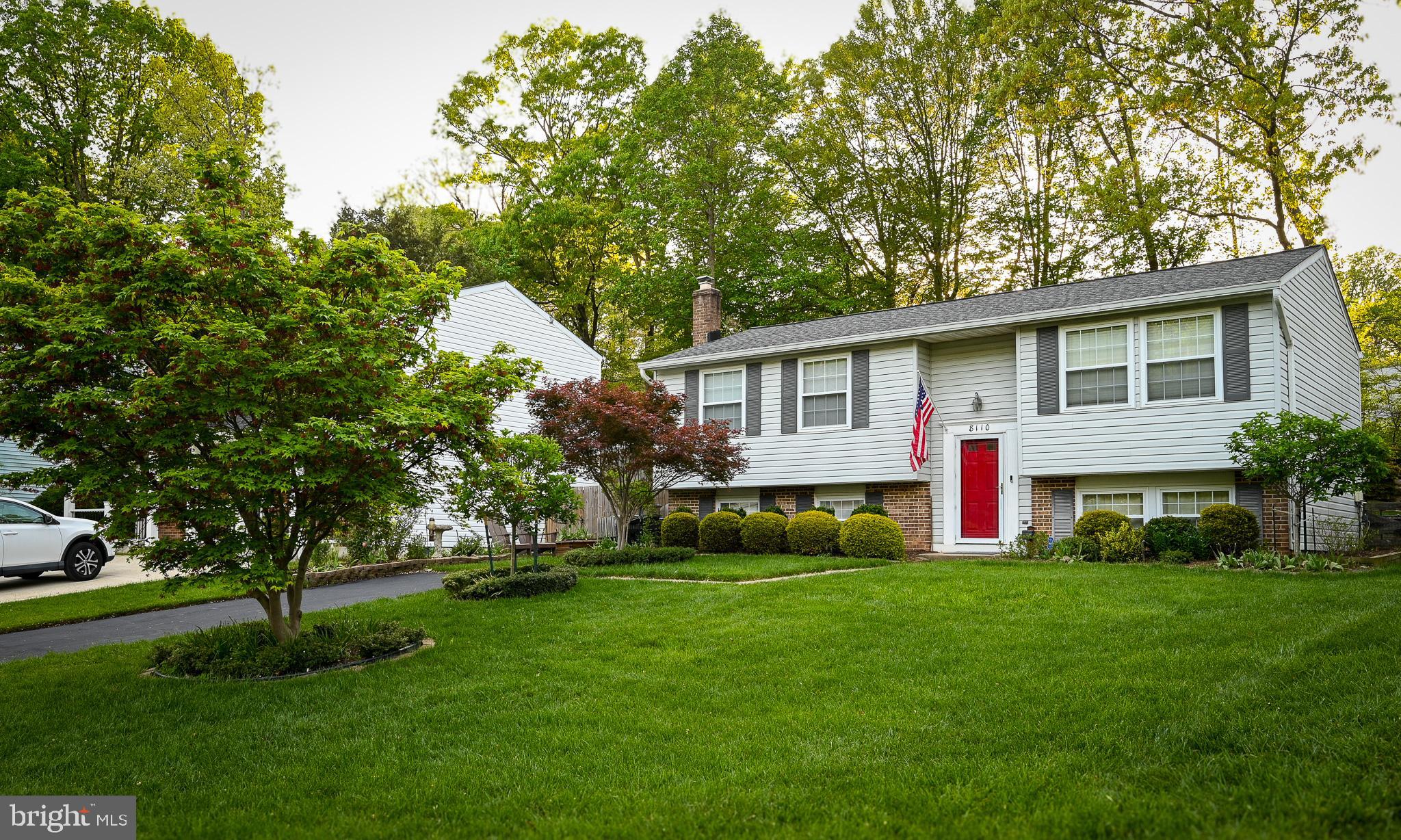 8110 Winter Blue Court Springfield, VA 22153 - Photo 1 of 24 a front view of house with yard and green space