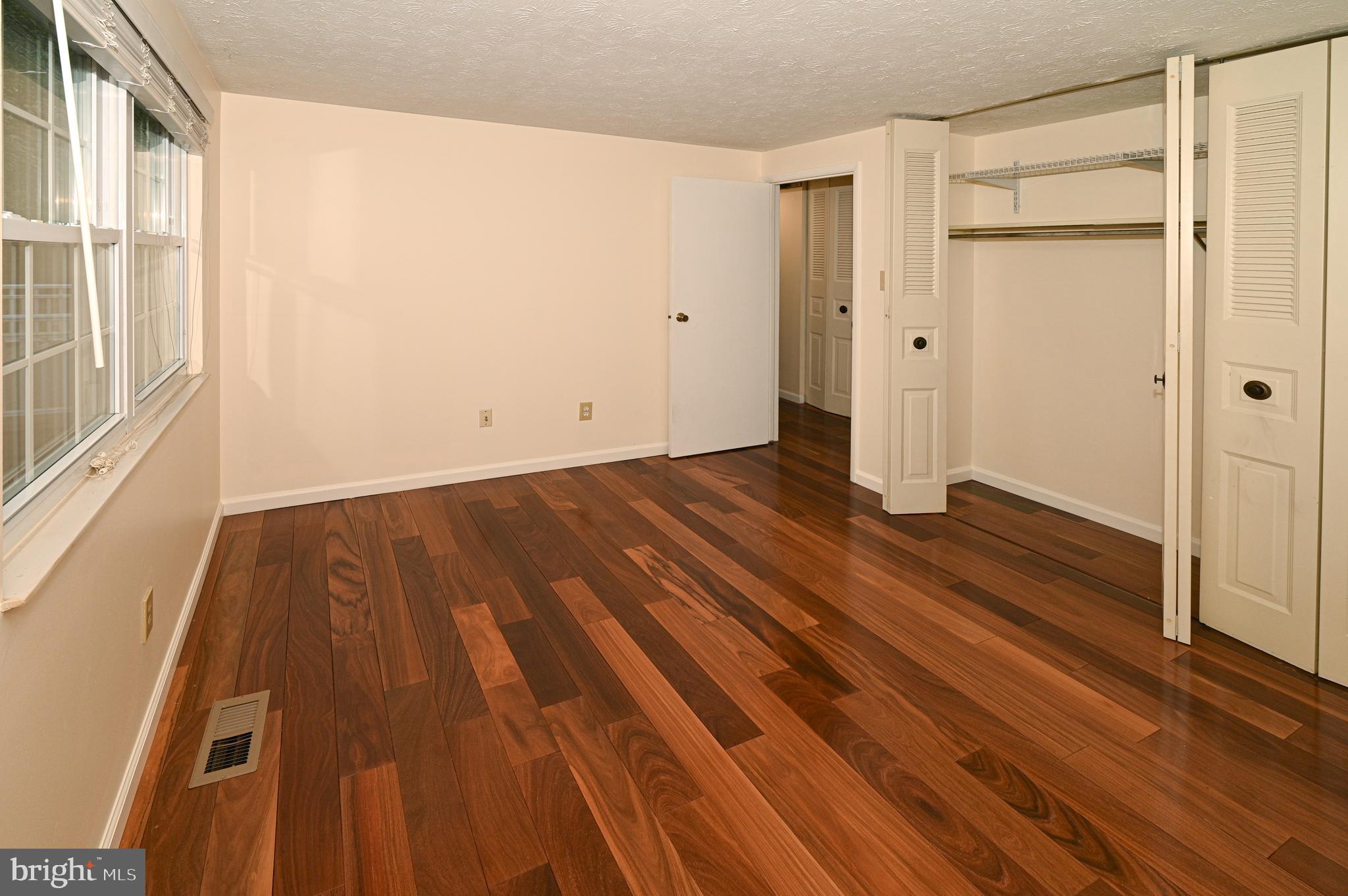 8110 Winter Blue Court Springfield, VA 22153 - Photo 11 of 24 a view of a room with wooden floor and a window