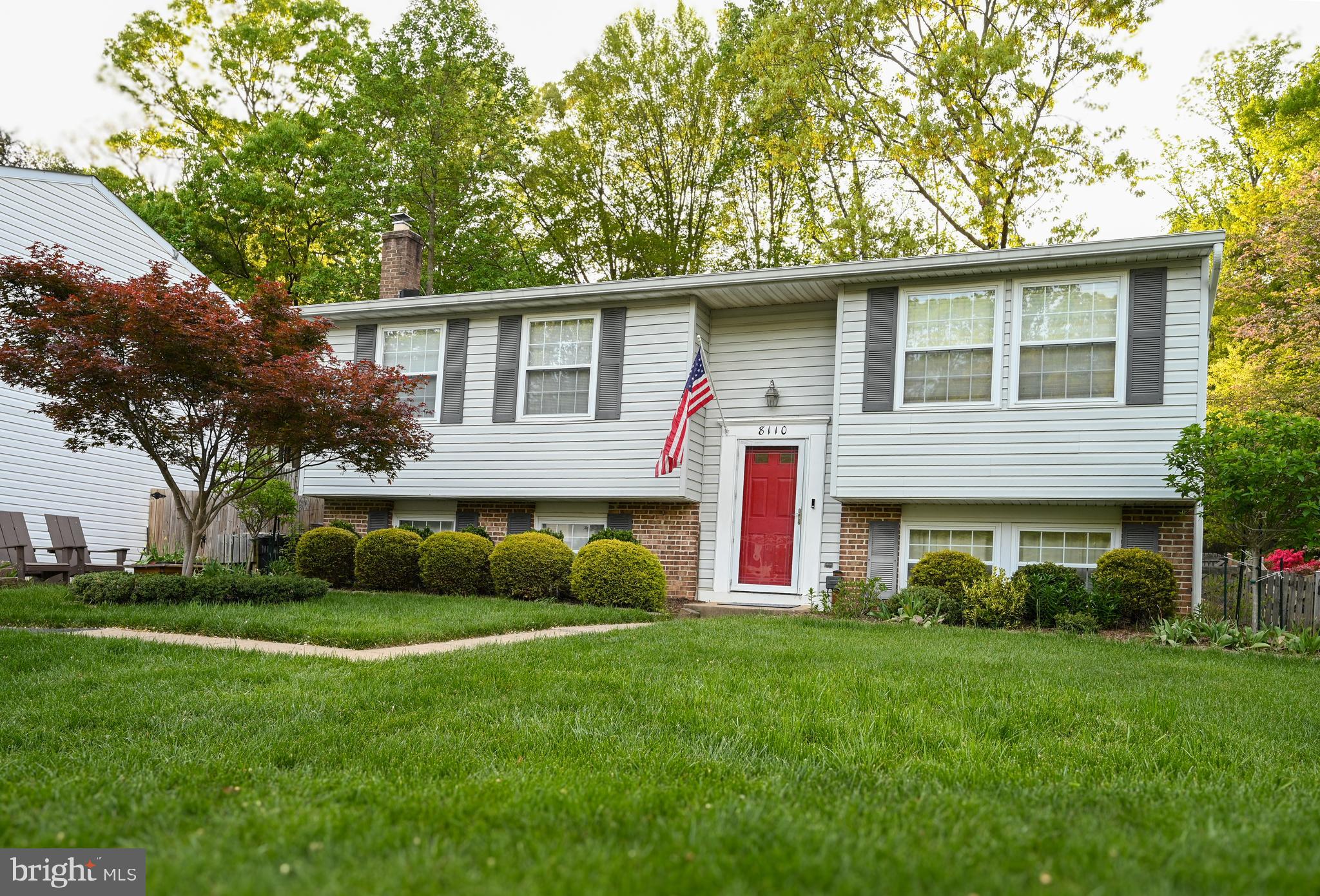 8110 Winter Blue Court Springfield, VA 22153 - Photo 2 of 24 a front view of a house with garden