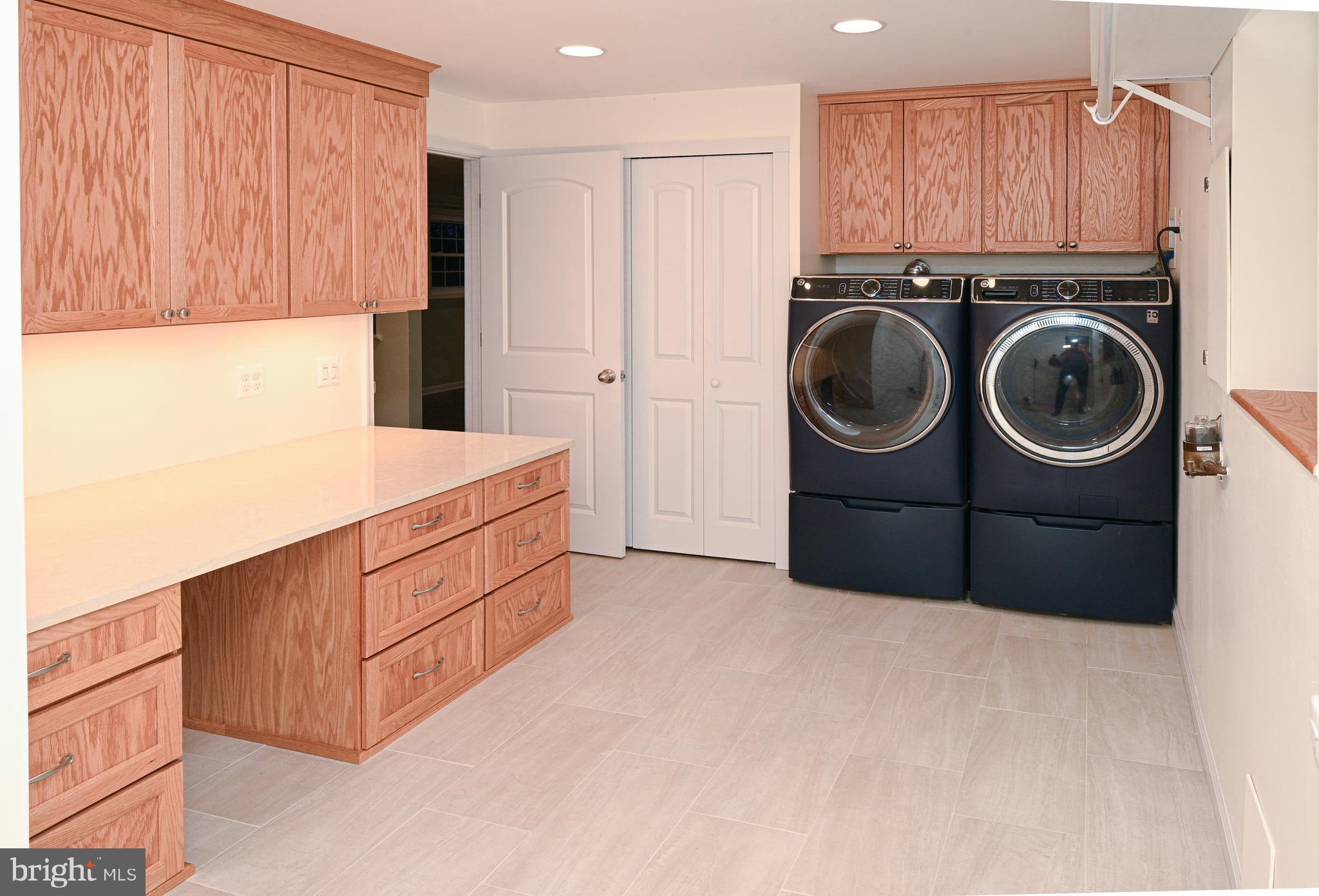 8110 Winter Blue Court Springfield, VA 22153 - Photo 21 of 24 a utility room with sink dryer and washer