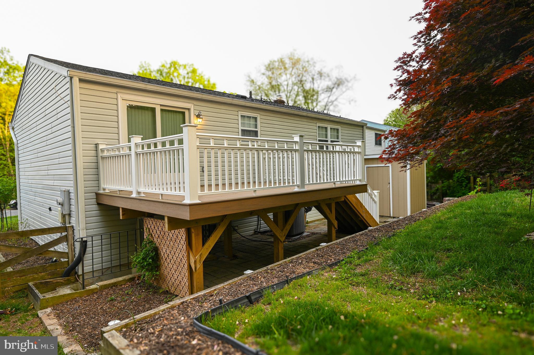 8110 Winter Blue Court Springfield, VA 22153 - Photo 24 of 24 a view of a house with backyard and deck