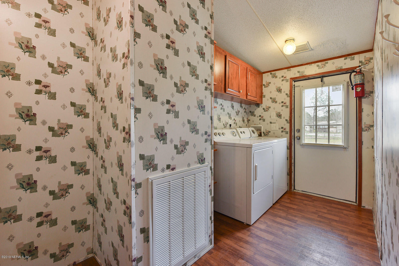 75302 Edwards Road Yulee, FL 32097 - Photo 19 of 25 a bathroom with a sink a vanity and a mirror