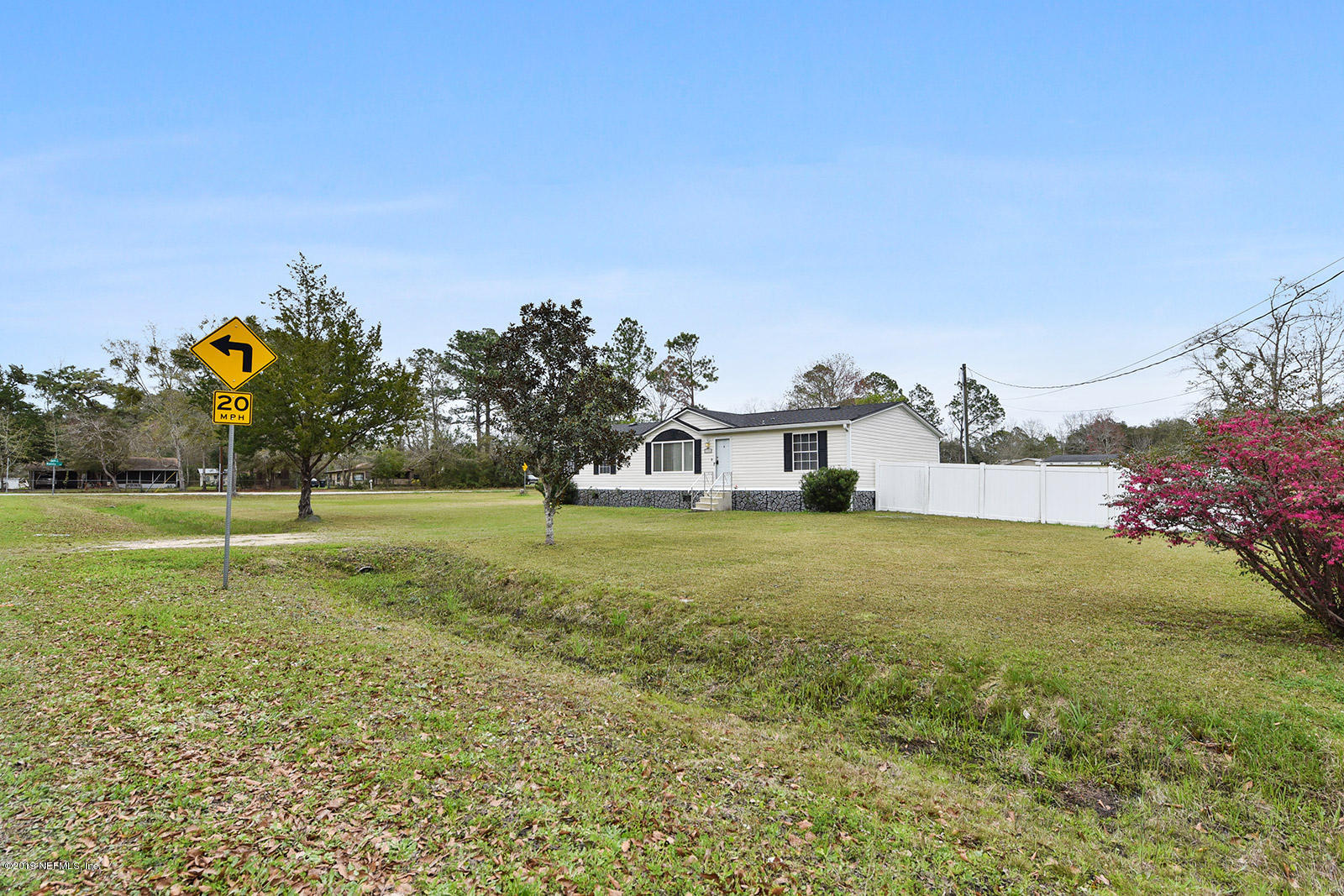 75302 Edwards Road Yulee, FL 32097 - Photo 2 of 25 a house with garden in front of it