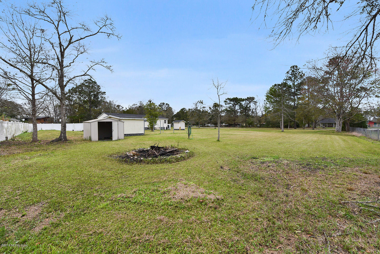 75302 Edwards Road Yulee, FL 32097 - Photo 23 of 25 a view of a house with a yard