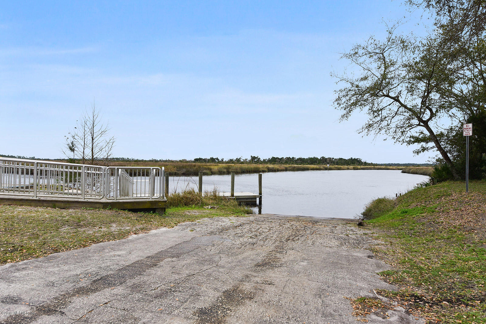 75302 Edwards Road Yulee, FL 32097 - Photo 24 of 25 a view of a lake with a big yard
