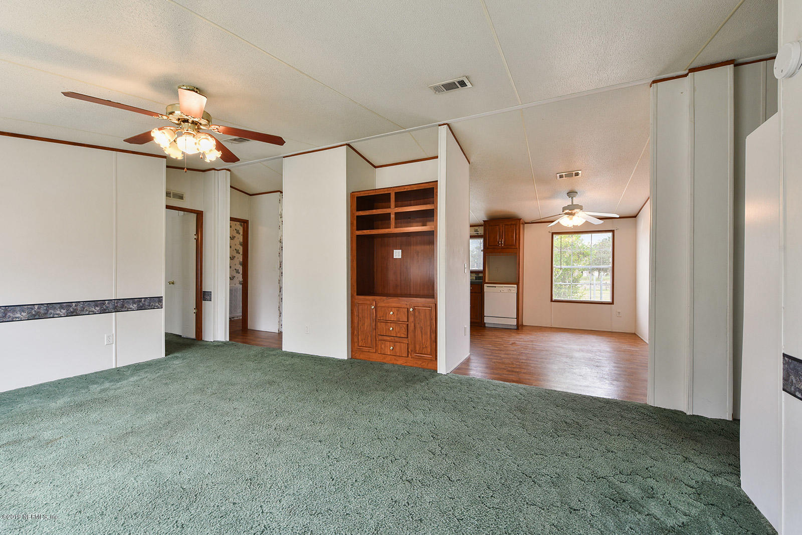 75302 Edwards Road Yulee, FL 32097 - Photo 6 of 25 a view of a hallway with an empty room