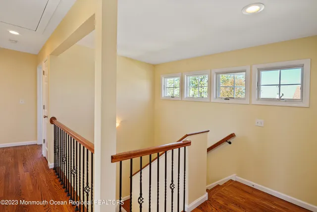a view of an entryway with wooden floor