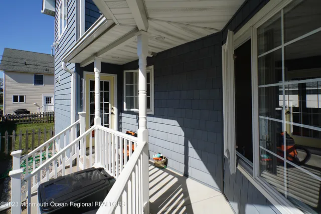 a front view of a house with a yard fire pit and outdoor seating