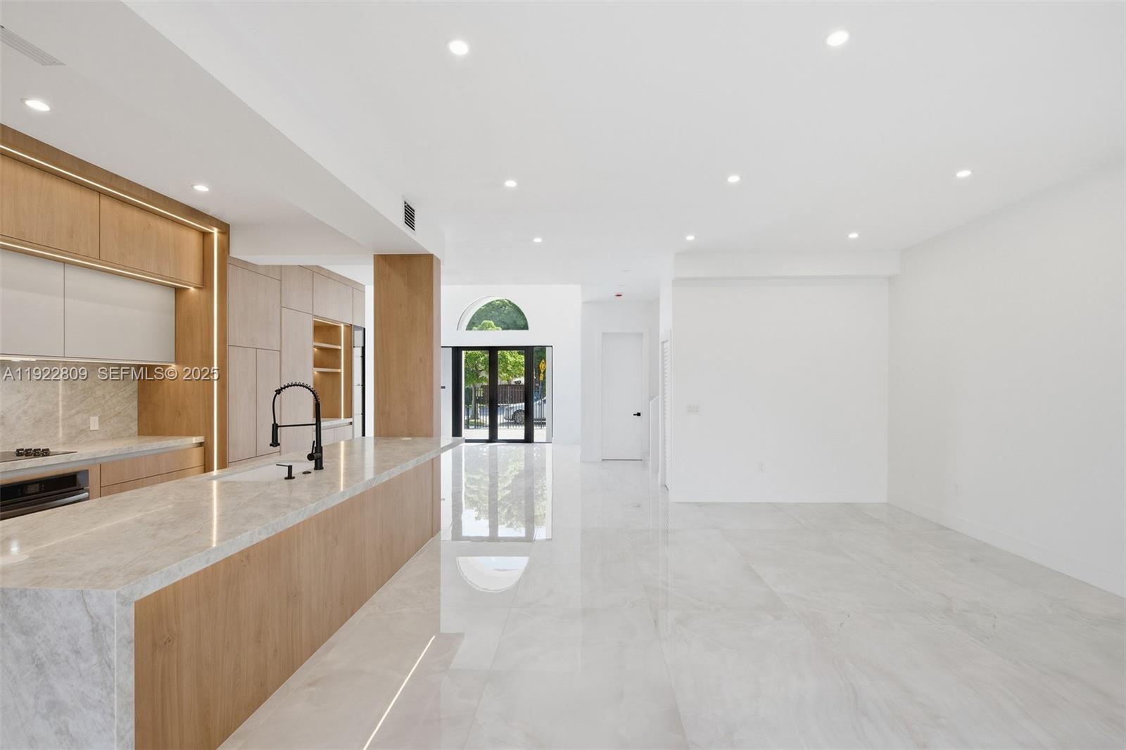 3111 Southwest 12th Street, Unit A Miami, FL 33135 - Photo 11 of 35 a large white kitchen with granite countertop a large window