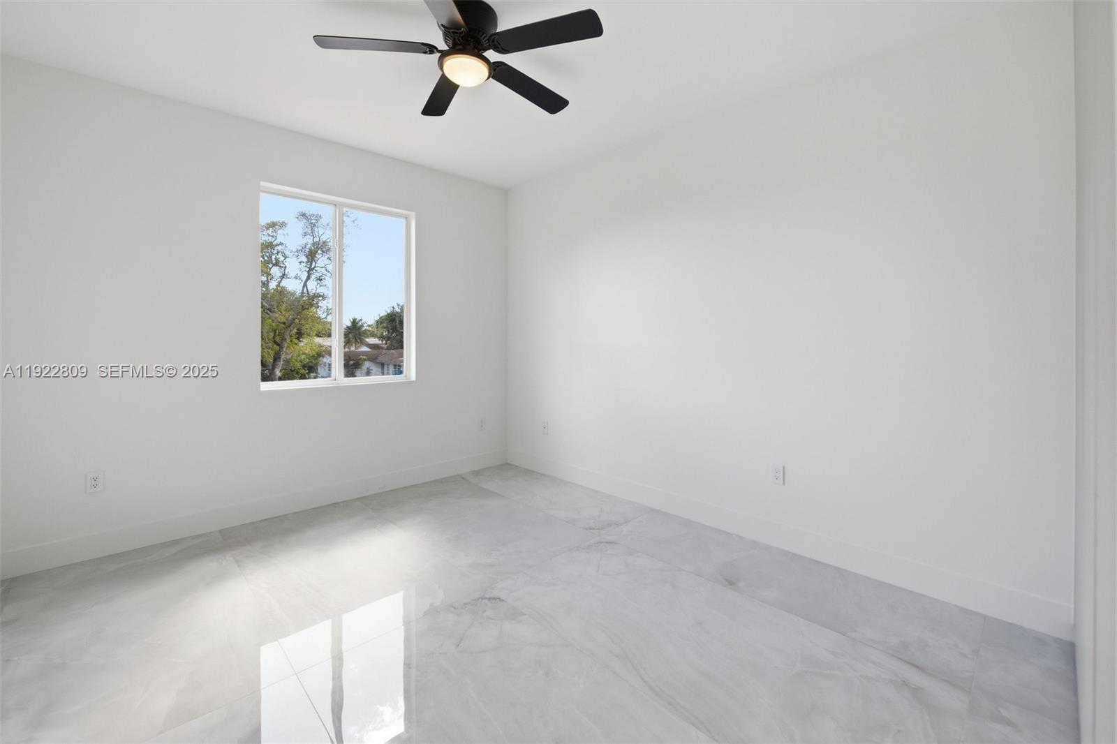 3111 Southwest 12th Street, Unit A Miami, FL 33135 - Photo 20 of 35 a view of an empty room with a window