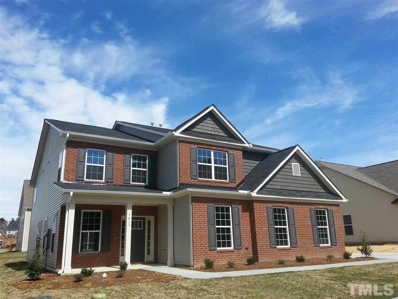 7613 Channery Way Raleigh, NC 27616 - Photo 1 of 25 a front view of a house with a yard