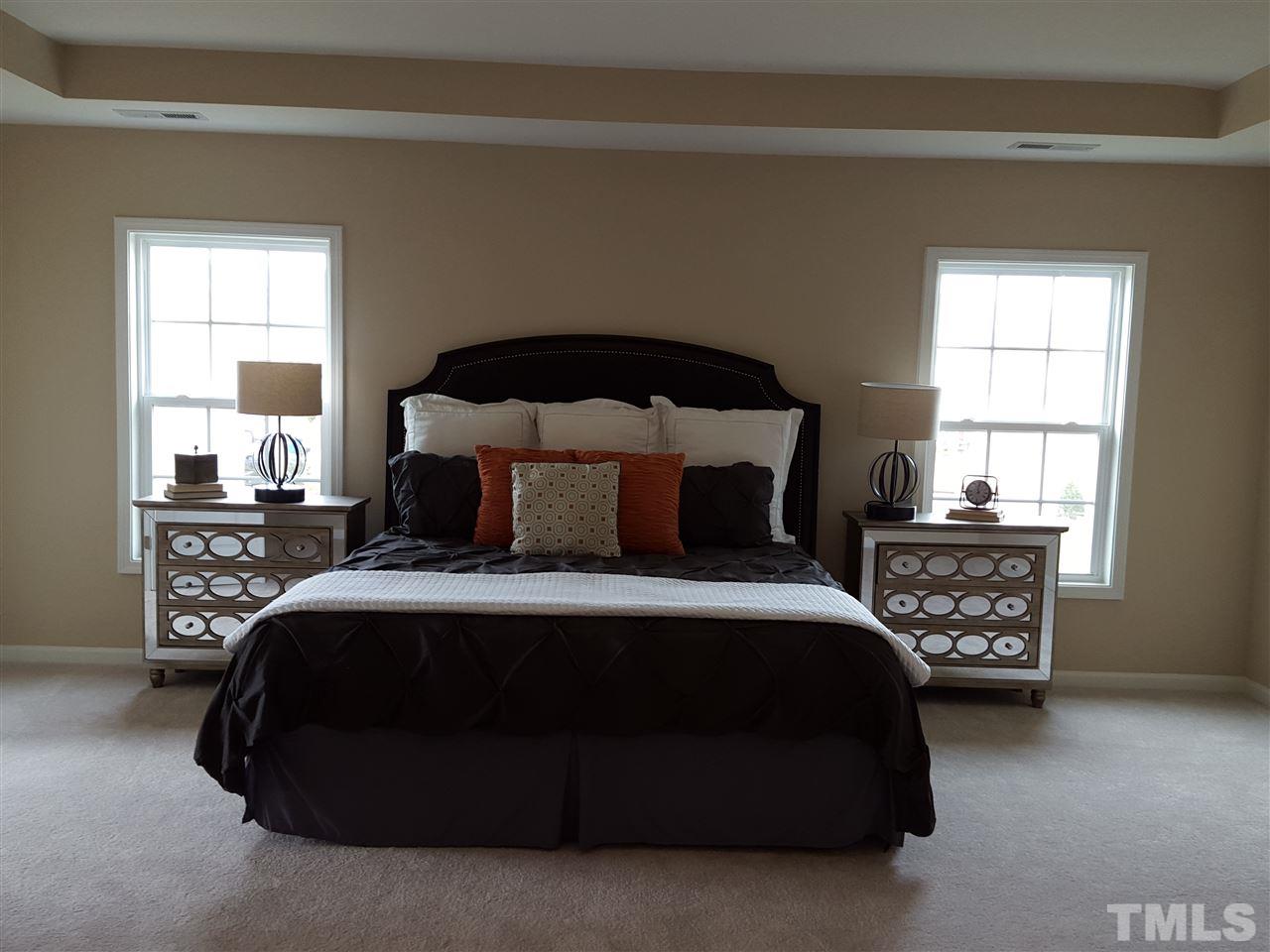 7613 Channery Way Raleigh, NC 27616 - Photo 11 of 25 a bedroom with a bed and a window