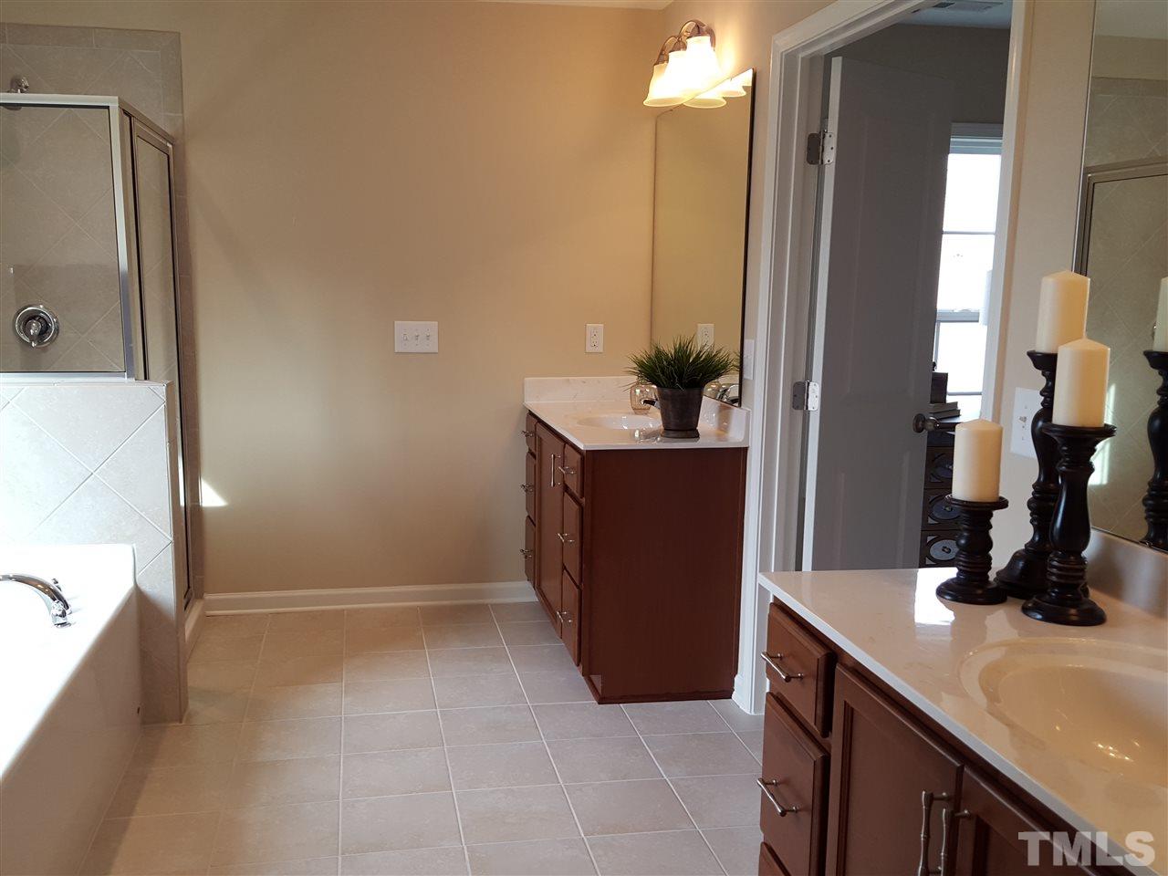 7613 Channery Way Raleigh, NC 27616 - Photo 12 of 25 a room with a sink and a mirror
