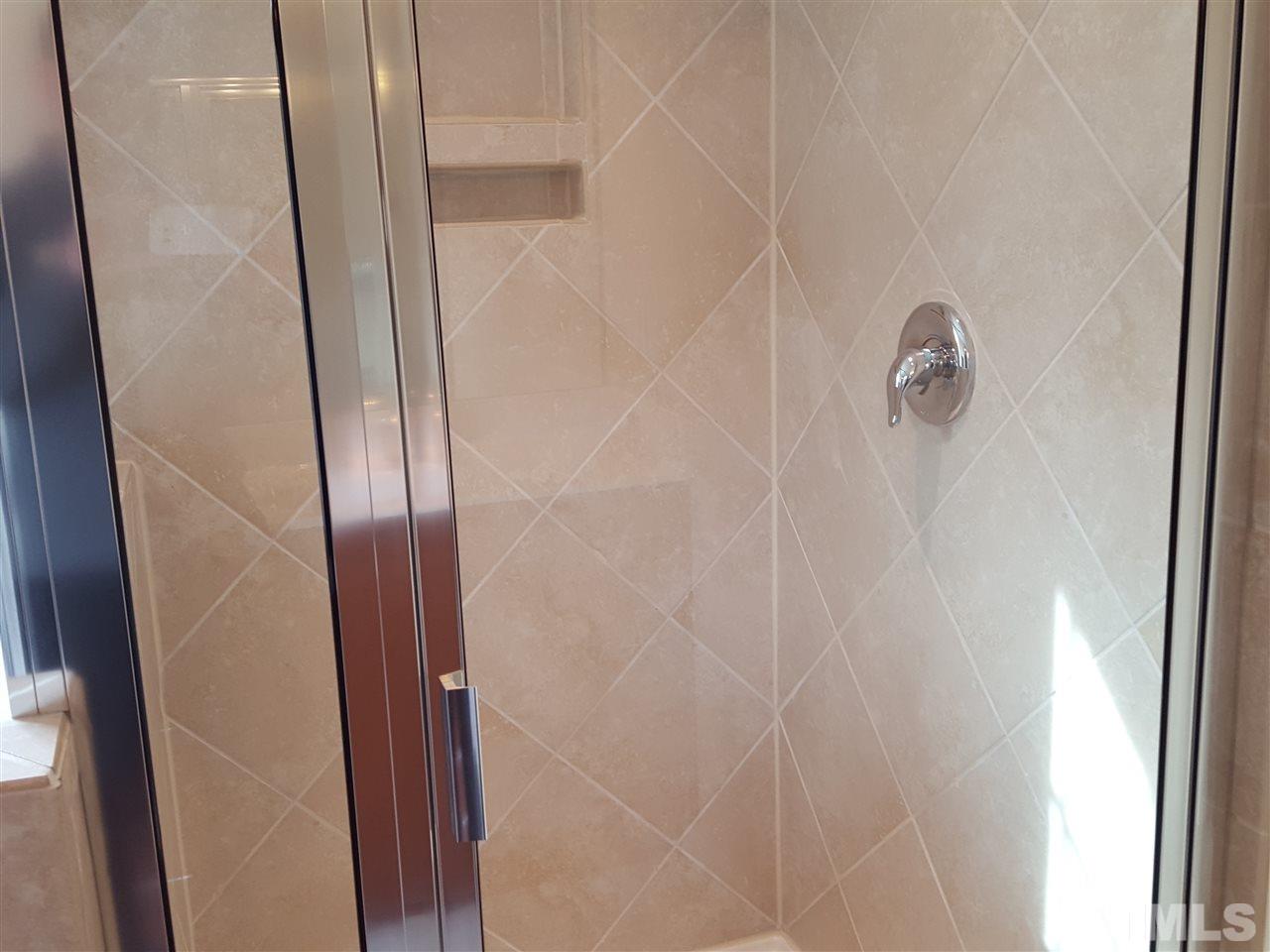 7613 Channery Way Raleigh, NC 27616 - Photo 13 of 25 a bathroom with a shower