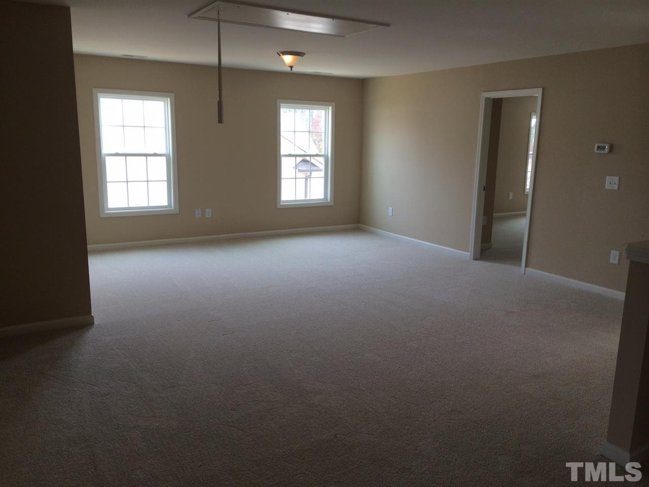 7613 Channery Way Raleigh, NC 27616 - Photo 15 of 25 an empty room with windows and closet