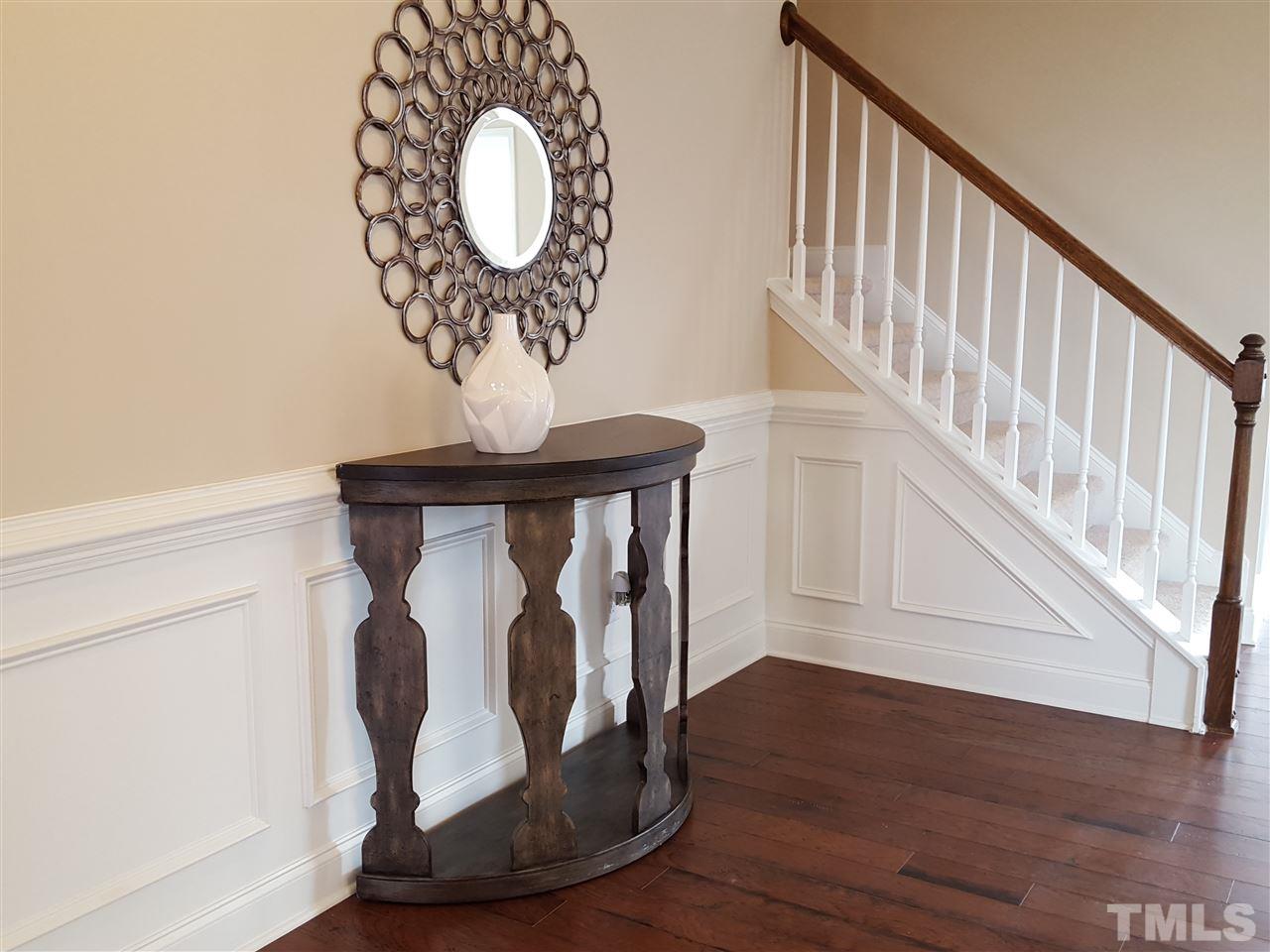 7613 Channery Way Raleigh, NC 27616 - Photo 4 of 25 a view of entryway with wooden floor