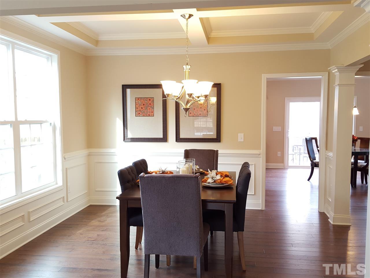 7613 Channery Way Raleigh, NC 27616 - Photo 5 of 25 a view of a a dining room with furniture window and wooden floor