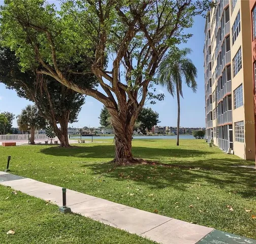 a view of a swimming pool and a big yard