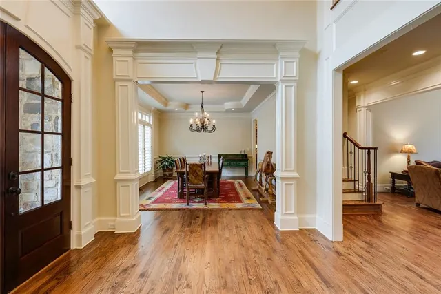 a view of a room with wooden floor furniture and a window