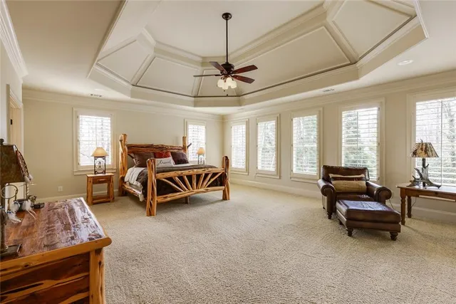 a bedroom with furniture and a chandelier