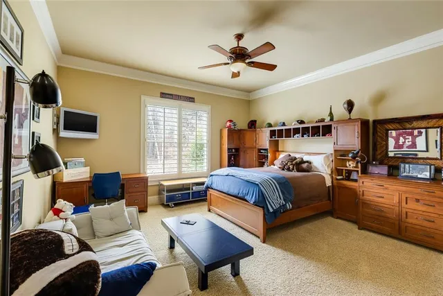 a bedroom with a bed and a couch