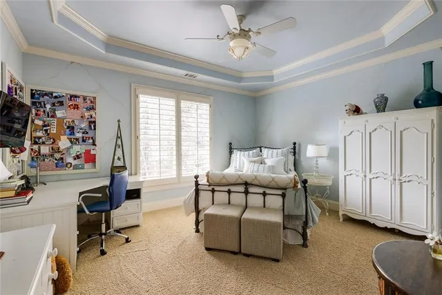 a bedroom with furniture and a window