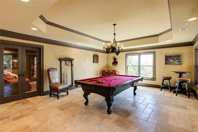 a living room with a table and gym equipment