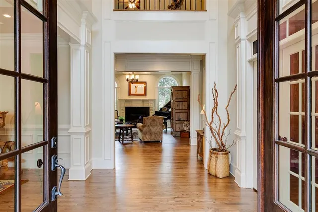 a living room with fireplace furniture and a wooden floor