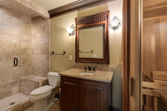 a balcony with furniture and a large window