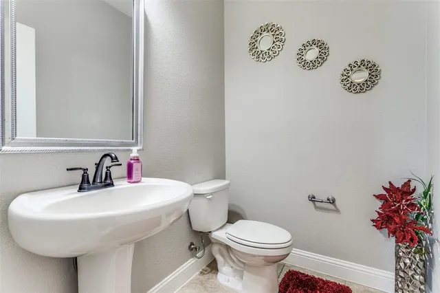 a bathroom with a sink and a toilet