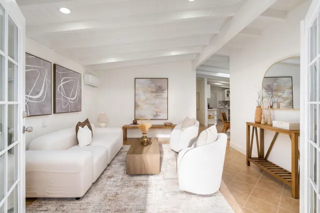 a bedroom with a bed and a couch