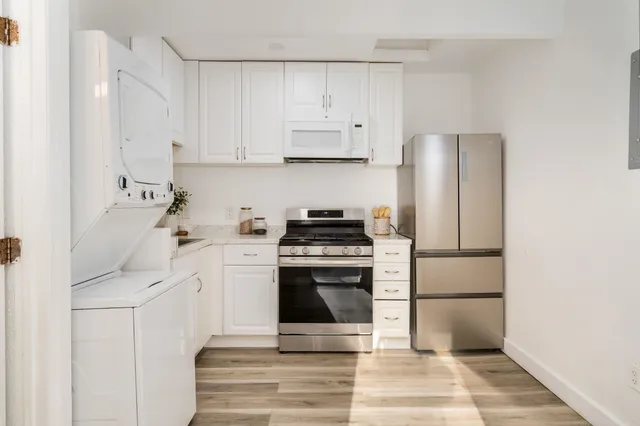 a bathroom with a sink toilet and mirror