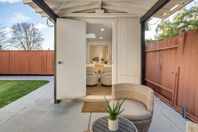 a view of a patio in the backyard