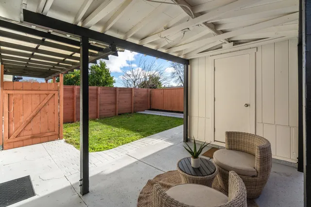 a living room with furniture and a rug