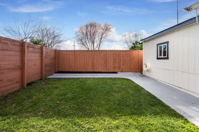 a wooden deck with a yard