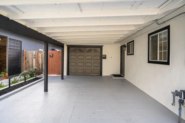 a view of an empty room and a window