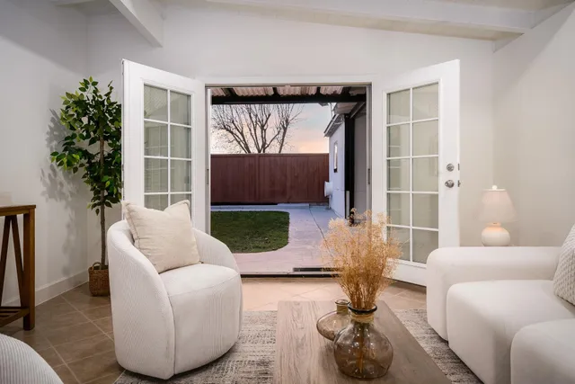 a living room with furniture and a rug