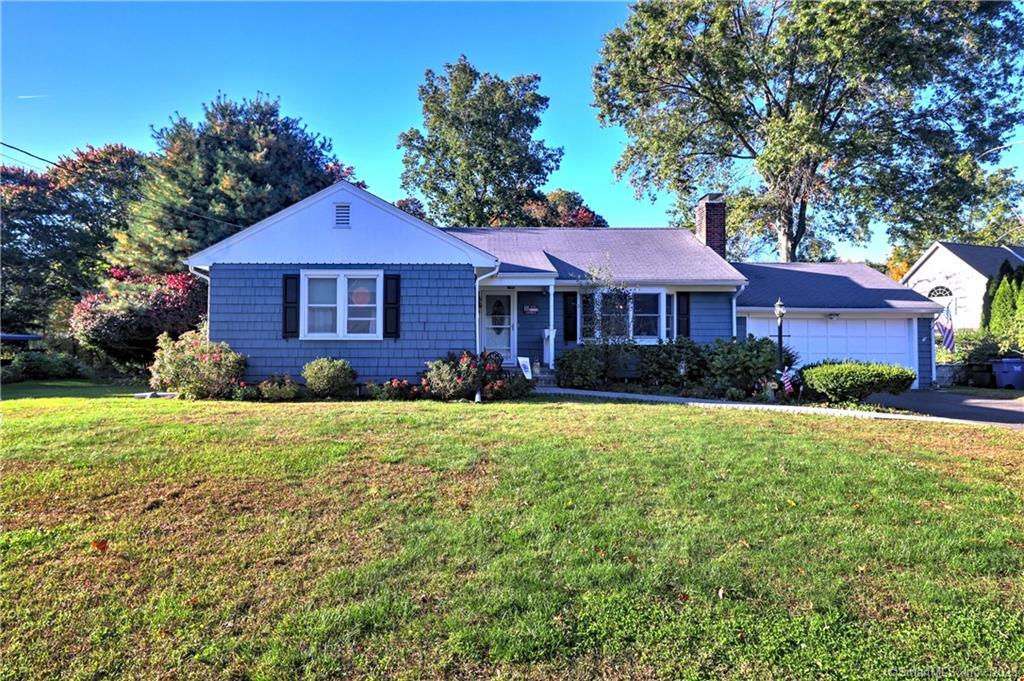 2 Morningside Terrace Trumbull, CT 06611 - Photo 1 of 1 a front view of a house with a yard and garage