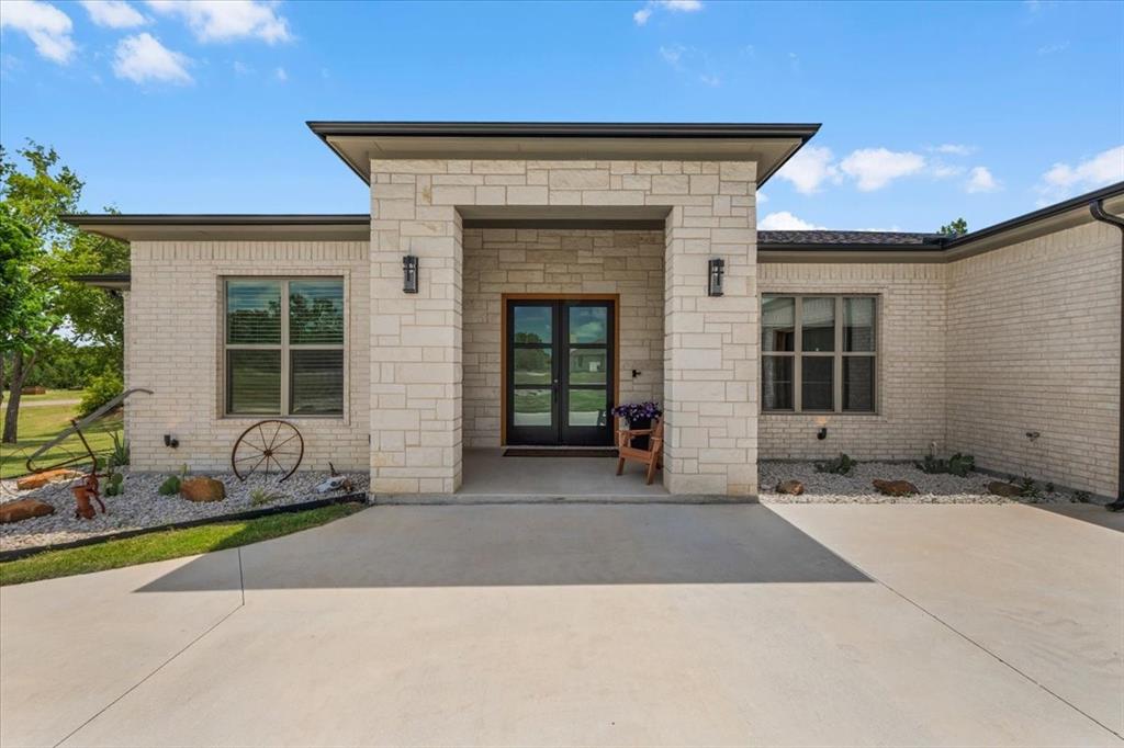 1039 Monaco Court Springtown, TX 76082 - Photo 27 of 33 Front of property featuring double front entry doors