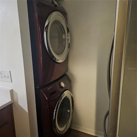 a bathroom with a granite countertop toilet a sink and a shower