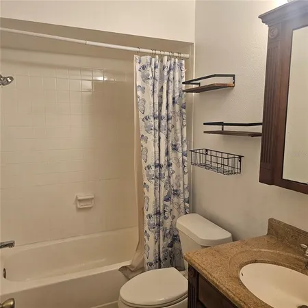 a view of a house with swimming pool and a yard