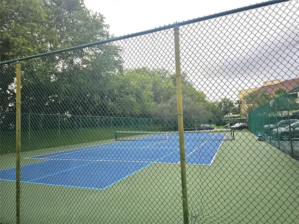 a view of a fountain in front of a house