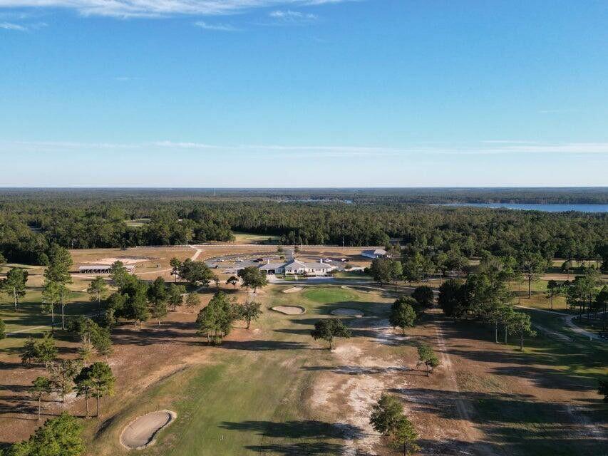 0 Washington Boulevard Chipley, FL 32428 - Photo 8 of 12 an aerial view of a house with a lake view