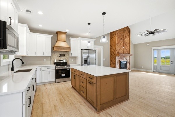 1180 Belfast Farmington Road Lewisburg, TN 37091 - Photo 14 of 41 a kitchen with stainless steel appliances granite countertop a sink stove and refrigerator
