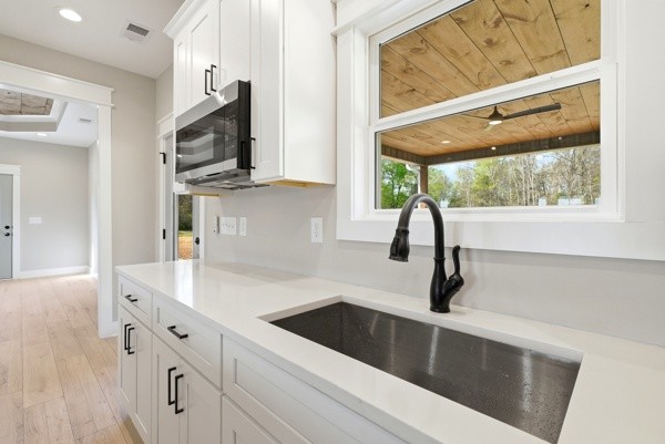 1180 Belfast Farmington Road Lewisburg, TN 37091 - Photo 17 of 41 a kitchen with stainless steel appliances a sink a stove and microwave